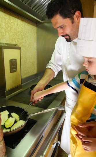 Learning the perfect way to sauté vegetables in the cooking class 